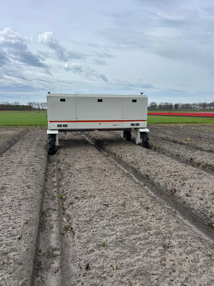 A Robot One autonomous machine standing between planted ridges in a Dutch field
